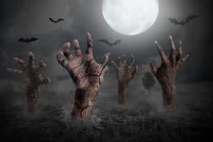 zombie hand rising out of the ground